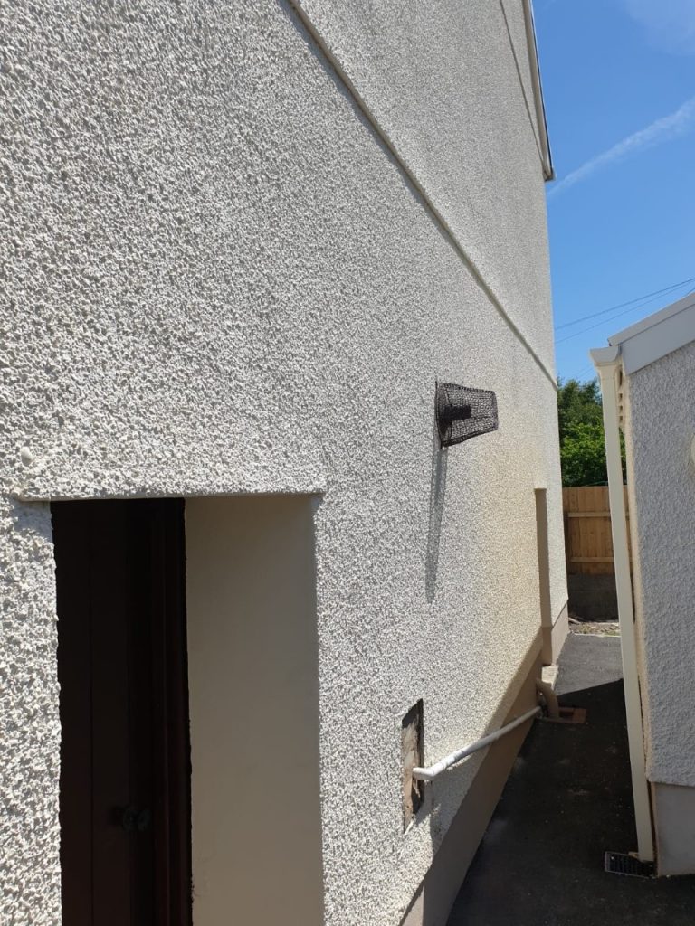 Rear side view of Exterior wall painted by Painting Specialists Swansea